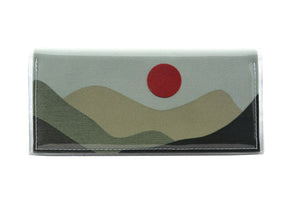 This is an image of the rear of a Kitty Came Home bifold purse clutch in the 'Moondance' design by Satin and Tat. A blood red full moon floats above a landscape of towering dark green hills. This is the standard size.