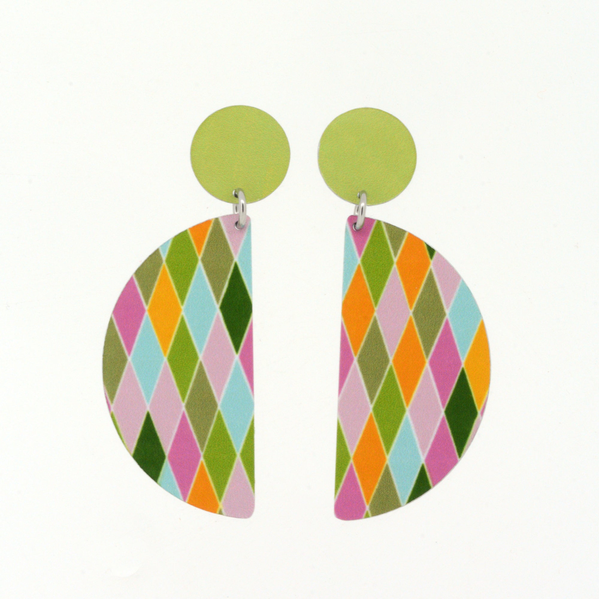 The is a photograph of earrings. 36 millimetre diameter semi-circles in a colourful harlequin pattern dangle from 12 millimetre green circle studs. The colours are pinks, blue, greens and yellows and originate from a photograph of daisies.