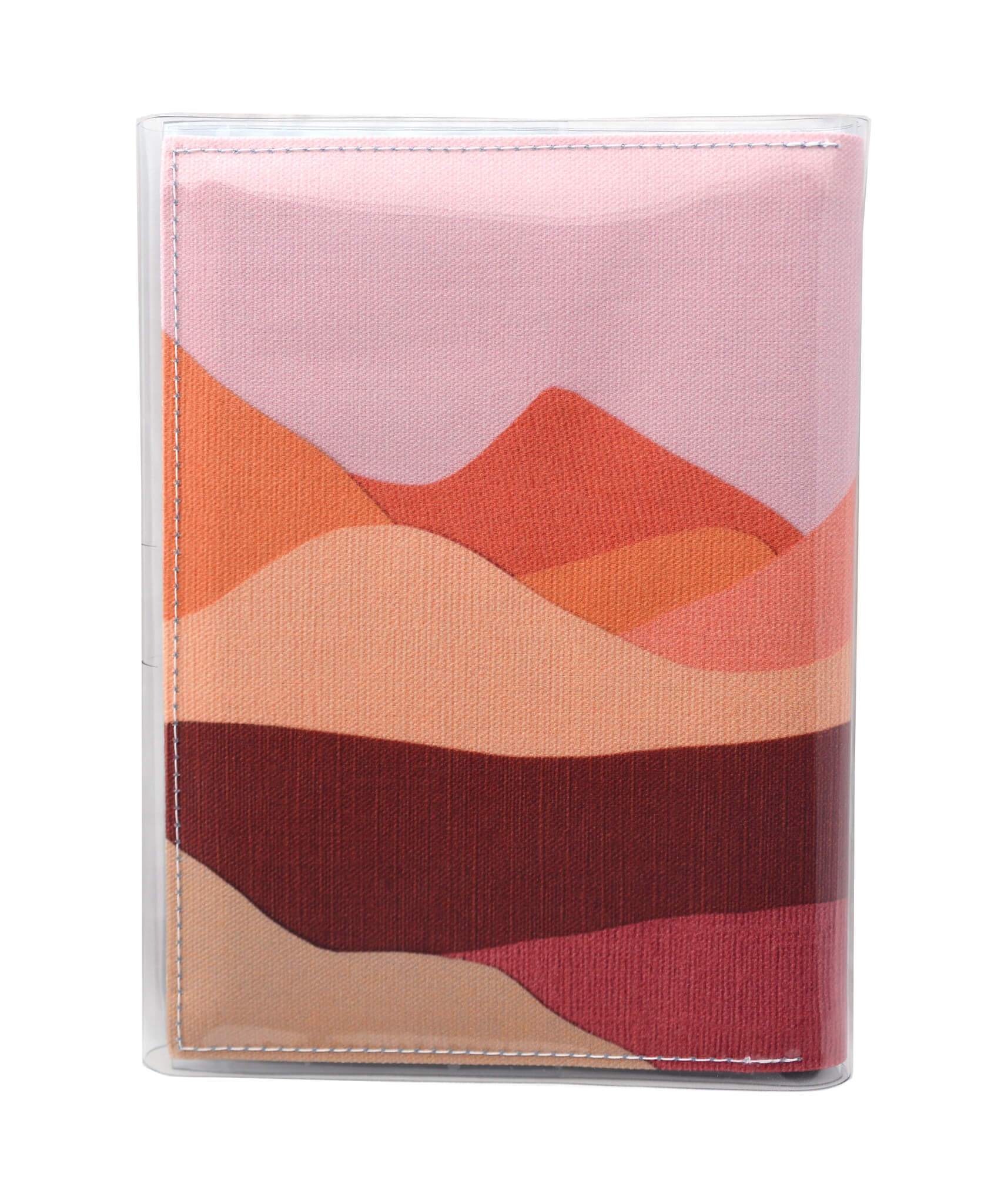 This is an image of the rear of a Kitty Came Home A5 journal in the 'Lilly of the valley' design by Satin and Tat. A landscape of orange, pink, burgundy and magenta hills beneath a dusty pink sky.