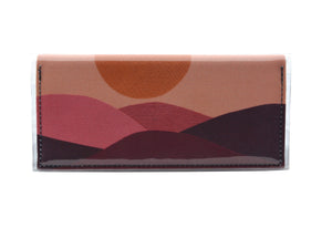 This is an image of the rear of a Kitty Came Home bifold purse clutch in the 'Moonage daydream' design by Satin and Tat. A golden moon suspended above a burgundy landscape. This is the standard size.