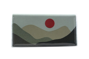This is an image of the rear of a Kitty Came Home bifold plus purse clutch in the 'Moondance' design by Satin and Tat. A blood red full moon floats above a landscape of towering dark green hills. This is the large size.