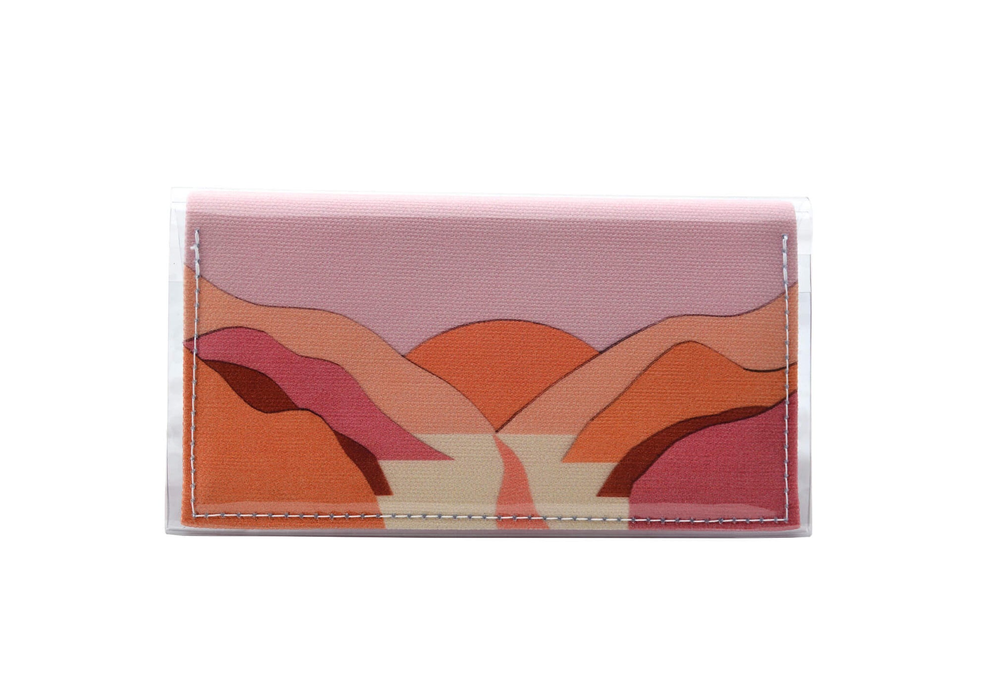 This is an image of the rear of a Kitty Came Home bifold mini purse clutch in 'The golden dawn' design by Satin and Tat. A path wends through a valley of pink and orange hills towards an orange rising sun. This is the small size.