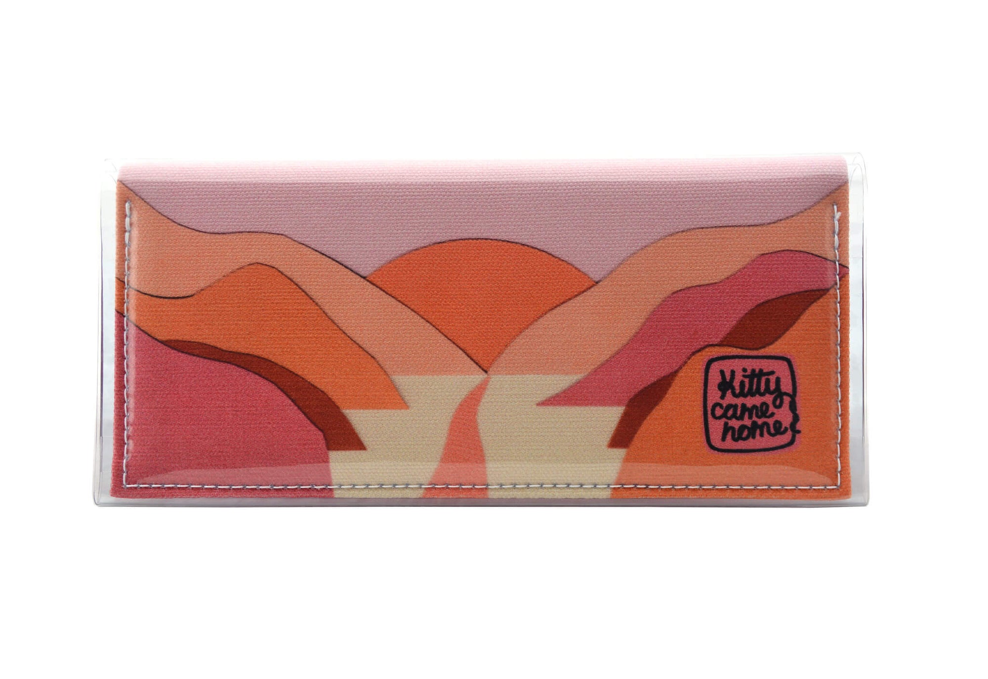 This is an image of the front of a Kitty Came Home bifold purse clutch in 'The golden dawn' design by Satin and Tat. A path wends through a valley of pink and orange hills towards an orange rising sun. This is the standard size.