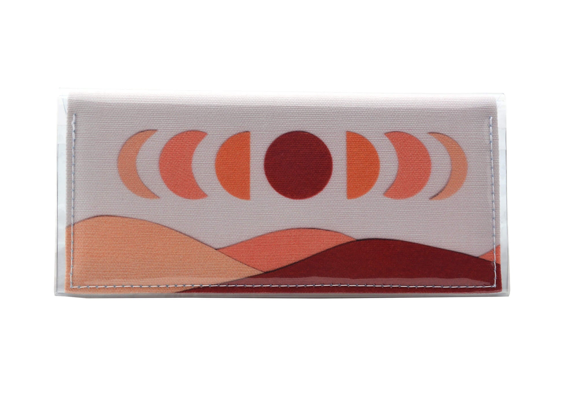 This is an image of the rear of a Kitty Came Home bifold purse clutch in 'The same moon rises' design by Satin and Tat. The moon appears in all its phases in a white sky above a landscape lit by the moon's colours: burgunday, oranges and apricot. This is the standard size.