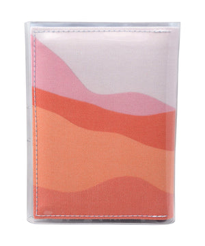 This is an image of the rear of a Kitty Came Home A6 journal in the 'Waiting for the sun' design by Satin and Tat. A landscape of pink hued sands rising to higher hills.
